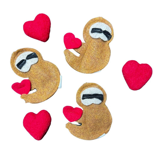 Group photo of handmade felt sloth cat toys with and without heart detail, compact shapes filled with catnip for interactive play, made by CatnipTakeout.