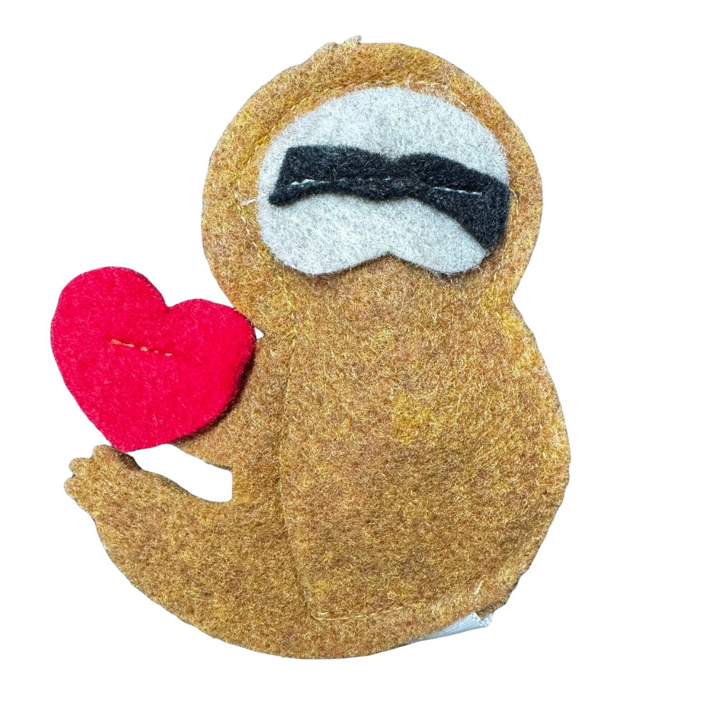 
Handmade felt sloth cat toy holding a red heart, soft felt texture with stitched details, filled with catnip for interactive play, made by CatnipTakeout.