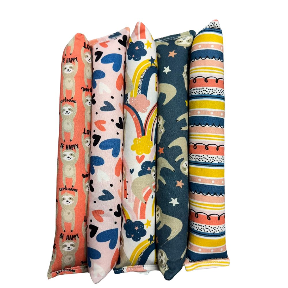 Handmade Sloth kicker cat toys shown together in five Valentine sloth prints, long tube shape designed for bunny-kicking and filled with signature premium catnip. Made by CatnipTakeout.