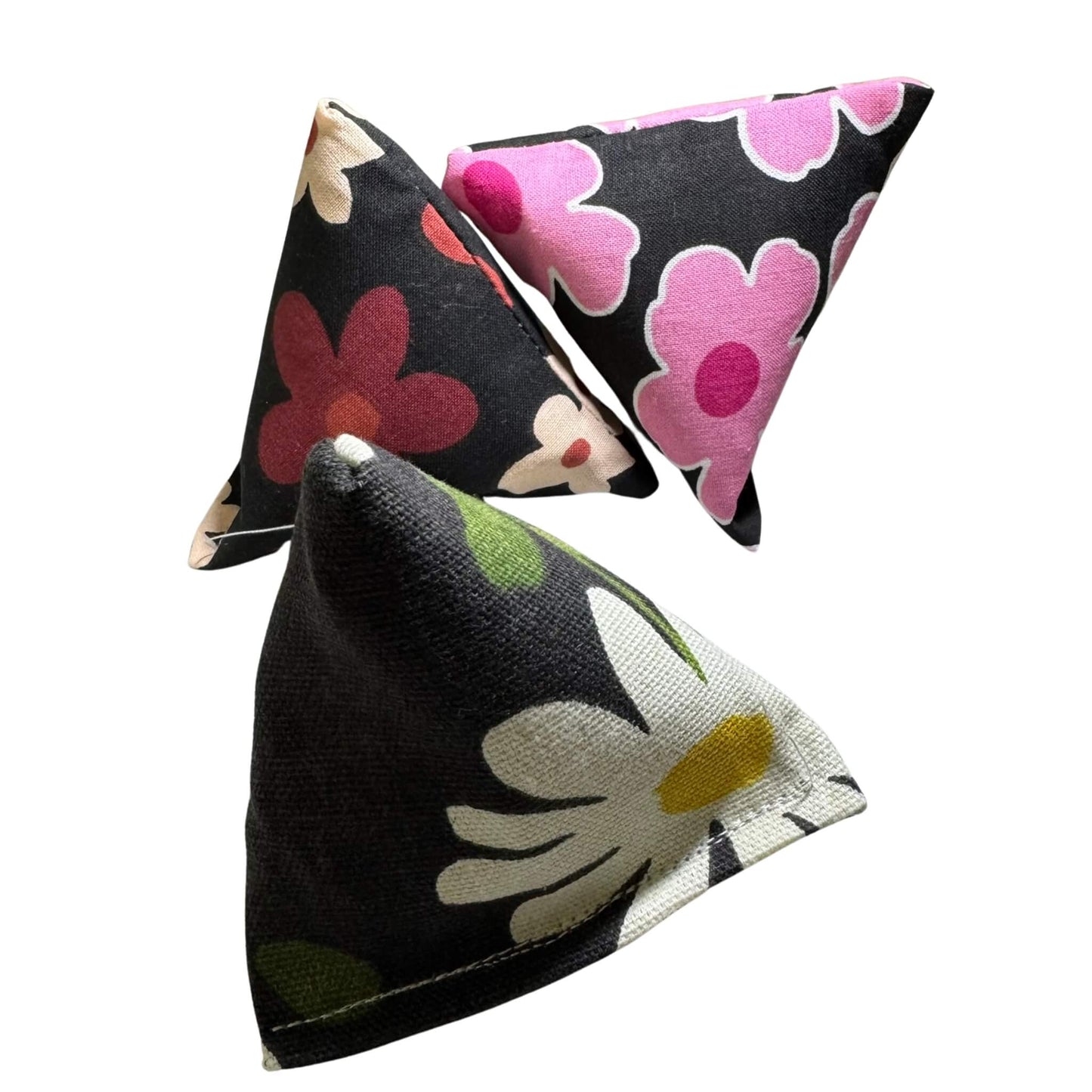 Trio of spring Happy Sack Cat Toys with retro daisy and pink floral designs, triangle-shaped and filled with catnip. Made by CatnipTakeout.