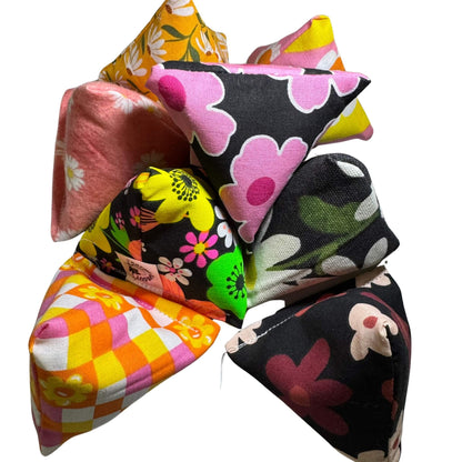 Spring Happy Sack Cat Toys in bold floral prints, stuffed with fresh, aromatic premium catnip. Triangle shape, perfect for pouncing. Made by CatnipTakeout.