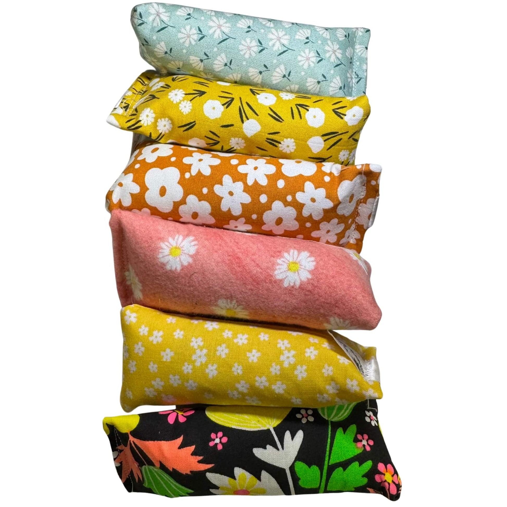 Mini spring cat toy in pink and white daisy floral fabric, sized at 5x2 inches. Filled with crinkle and our signature fresh, aromatic premium catnip. Made by CatnipTakeout.