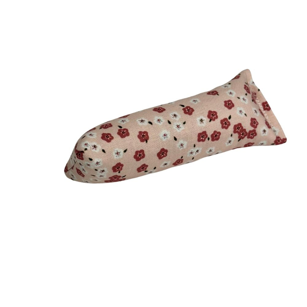 Blush pink mini kicker cat toy with tiny red floral print, filled with catnip for compact solo play sessions