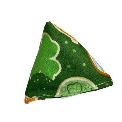 Green cookie and shamrock print catnip cat toy in pyramid shape for chasing and solo play