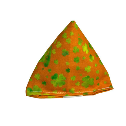 Orange pyramid catnip cat toy with repeating green clover print on cotton fabric