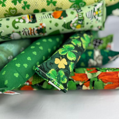 Group photo of St. Patrick’s Day kicker cat toys with shamrocks, clovers, and green patterns for bunny kicking play