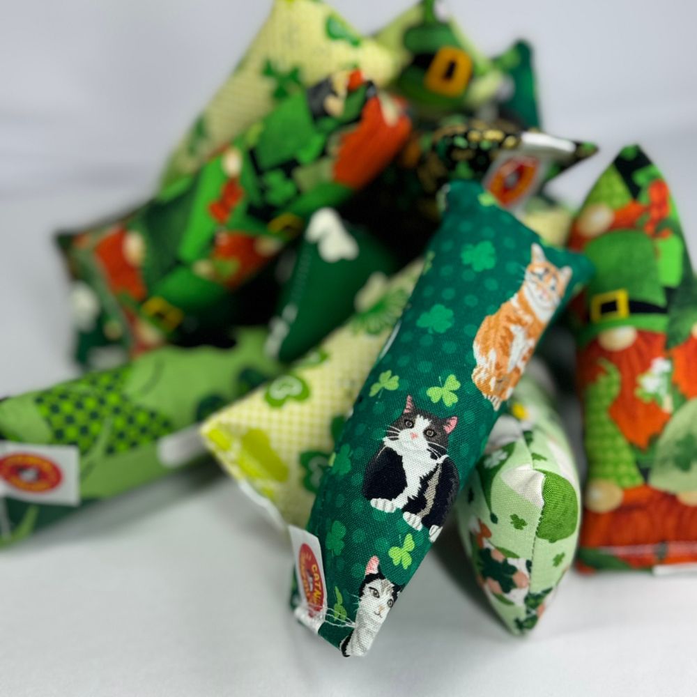 Collection of St. Patrick's Day colorful catnip toys with various designs on a white background