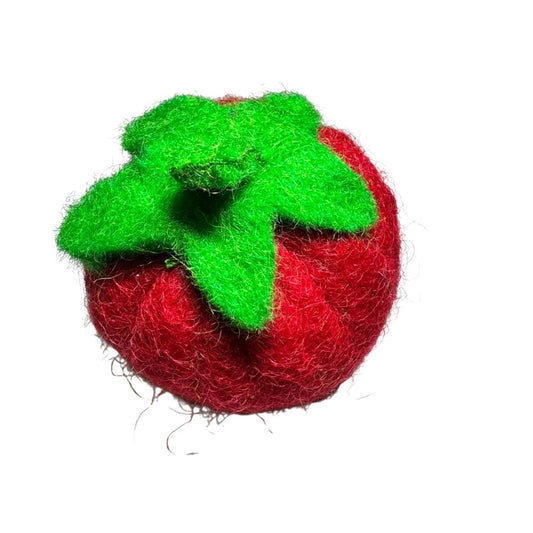 Tomato-shaped wool cat toy with a rounded red body and green leafy top, sprayed with aromatic catnip for rolling, batting, and interactive play. Made by CatnipTakeout.