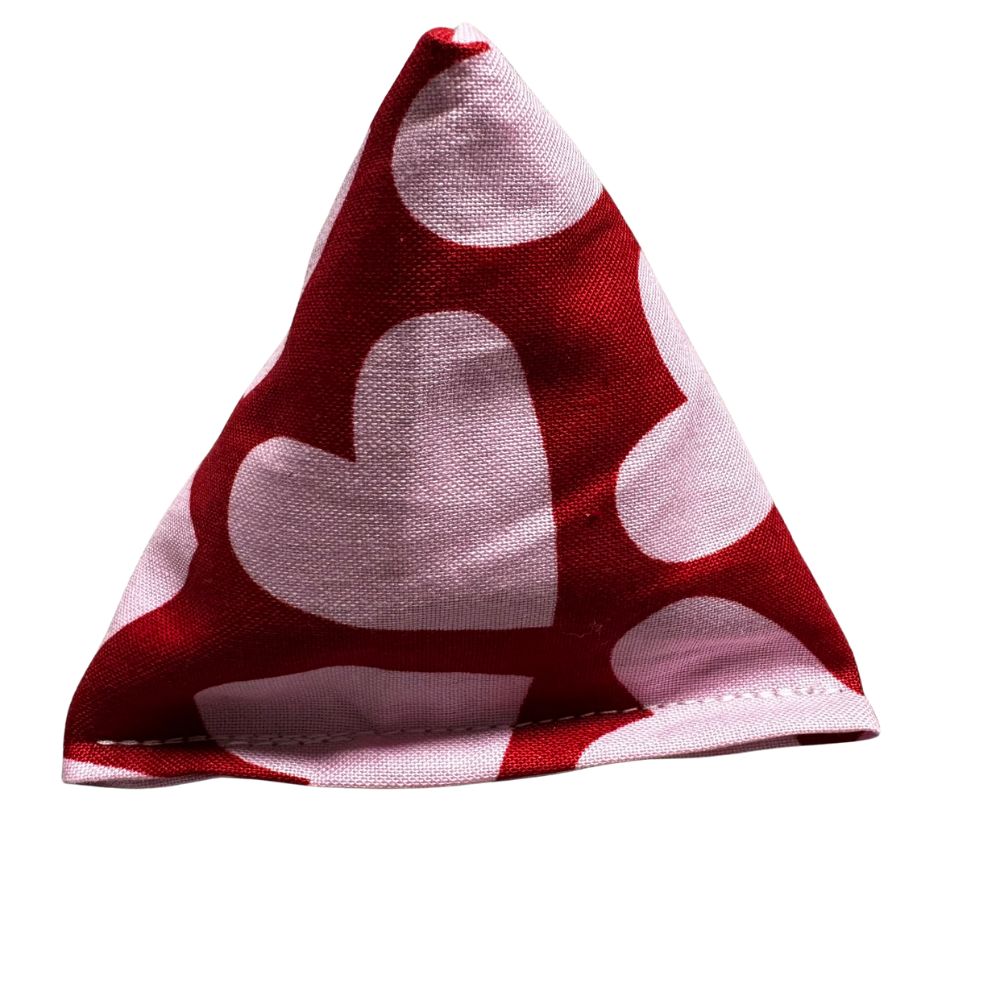 toy-catnip-toy-CatnipTakeout
Single handmade Valentine Happy Sack cat toy in red fabric with large pink heart shapes, pyramid-shaped and filled with signature premium catnip for batting and pouncing play. Made by CatnipTakeout.