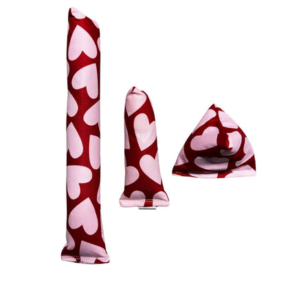 Three handmade Valentine cat toys shown together including one red heart kicker, one matching mini kicker, and one pyramid-shaped Happy Sack, all featuring bold heart designs and filled with signature premium catnip. Made by CatnipTakeout.