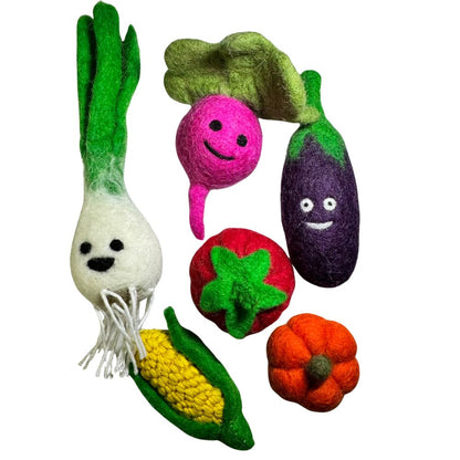 Group of wool vegetable cat toys including green onion, beet, eggplant, corn, tomato, and pumpkin, all sprayed with catnip and designed for interactive play. Made by CatnipTakeout.