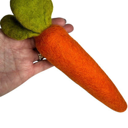 Wool carrot cat toy sprayed with catnip spray shown in hand for size reference - Medium 