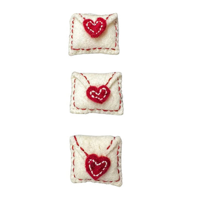 Three handmade wool love note envelope cat toys with red stitched heart seals, felted wool texture, sprayed with signature catnip spray. Made by CatnipTakeout.